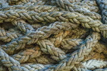 Twisted thick sea rope. Close-up view. Abstract background