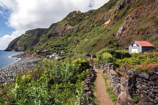 View of cliffs and settlement Rocha da Relva, southwest coast, island of Sao Miguel, Azores, Portugal, Europe