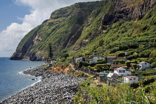View of cliffs and settlement Rocha da Relva, southwest coast, island of Sao Miguel, Azores, Portugal, Europe