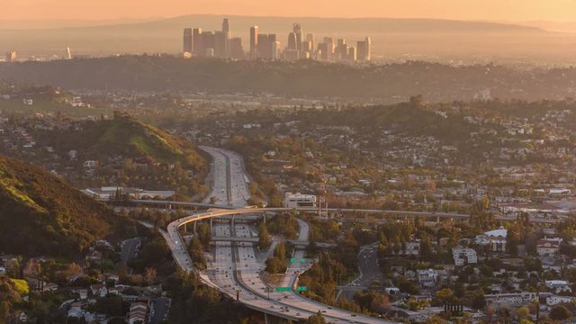 Day to night time lapse view of the Glendale 2 freeway and Downtown Los Angeles