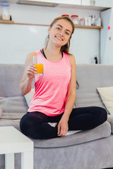 The girl is pleased with the useful properties of juice