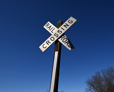 A closeup of a railroad crossing sign.