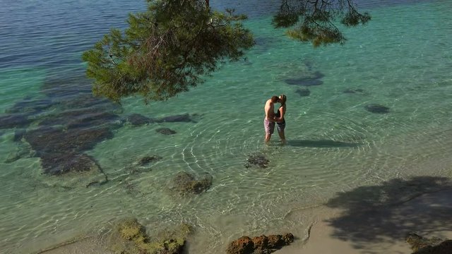Couple on the beach, Cala Pi de la Posada, Cap de Formentor, Majorca, Balearic Islands, Spain, Mediterranean, Europe