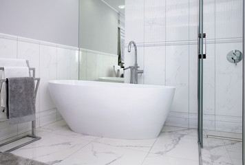 Naklejka na ściany i meble A modern style bathroom in a white-colored apartment