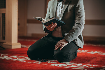 Muslim man praying in mosque