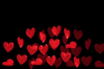 Red hearts on a dark background. Valentine's card.