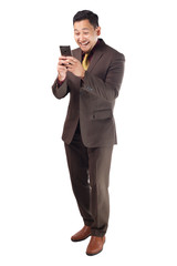 Attractive young businessman reading message on his phone, happy smiling