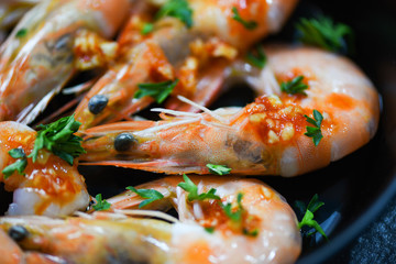 Seafood plate with shrimps prawns ocean gourmet dinner seafood cooked with sauce herbs and spices