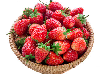 Strawberries in a basket isolated on white background