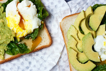 Sandwich with avocado and egg close-up, white and gray background, top view