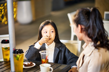 asian mother and daughter having a conversation