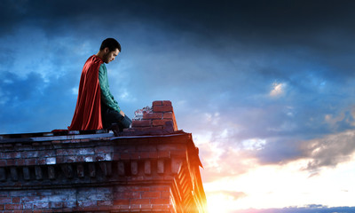 Super hero on roof. Mixed media