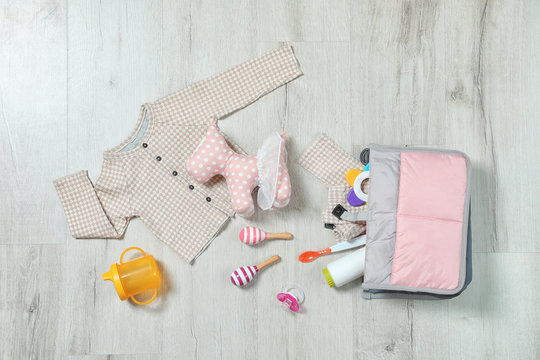 Flat lay composition with baby accessories on wooden background