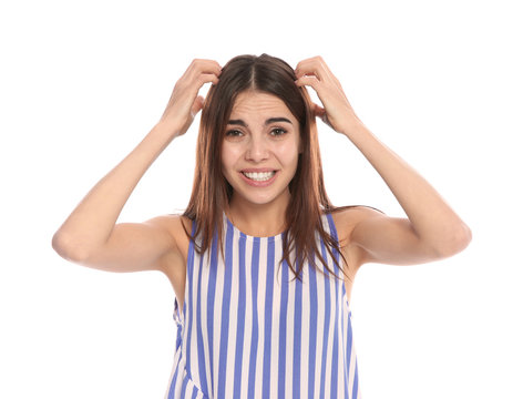 Young woman scratching head on white background. Annoying itch