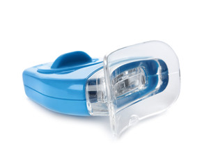 Tooth whitening device on white background. Dental care