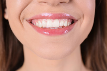 Young woman with healthy teeth and beautiful smile, closeup