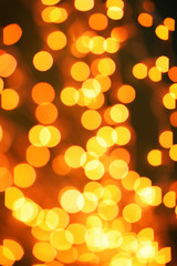 Beautiful gold lights on dark background. Bokeh effect