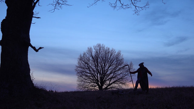 soft focus. Grim Reaper sunset silhouette. concept of death.