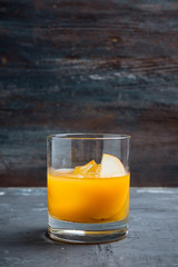 Old fashioned apple beverage on the rustic background. Selective focus.