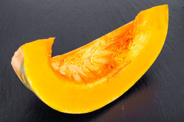 Pumpkin slice on black background