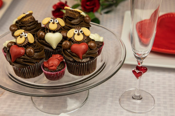 Valentine themed cupcakes with hearts and roses 