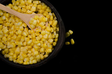 corn in a ceramic vessel and clay in the bottom of kitchen