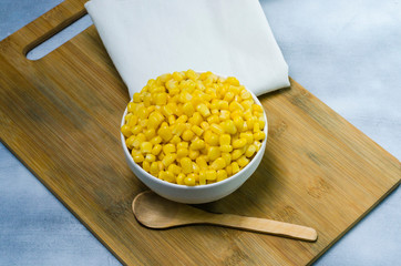 corn in a ceramic vessel and clay in the bottom of kitchen