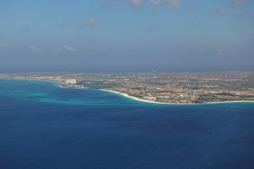 Fototapeta na wymiar Aerial view of the Caribbean island of Aruba in approach to the Queen Beatrix International Airport (AUA) in Oranjestad