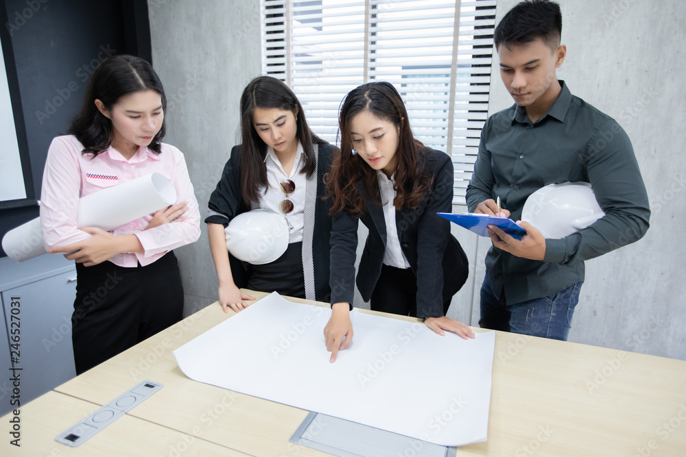 Poster businessmen and engineer group using notebook for business partners discussing documents and ideas a