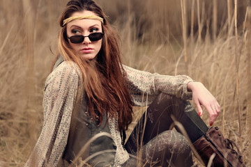 young sexy girl in hippy clothe on autumn field 