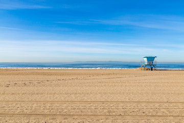 A lifeguard hut on Huntington Beach, California, on a sunny day