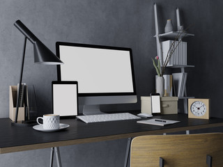 3d realistic render of mock up template of blank screen of computer, tablet on left and phone on right for your design works in trendy indoor workspace on messy designer desk in three quarter view