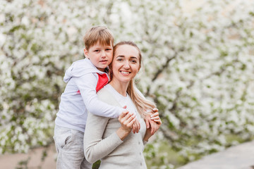 Fototapeta premium six-year-old boy hugging a young woman