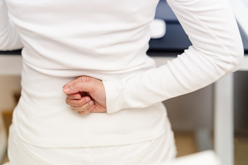 back pain woman working with computer. Healthcare and medical concept