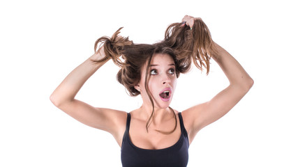 Upset surprised woman with tangled hair. Hair health concept