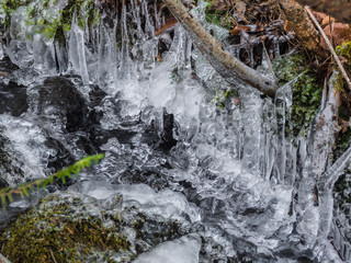 winter waterfall in the forest with ice