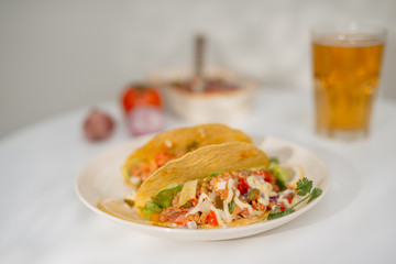 Authentic mexican tacos with beer. Mexican tacos with ground meat, beef, beans, onions and salsa