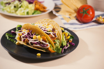 Traditional mexican taco with meat and vegetables. Latin american food.