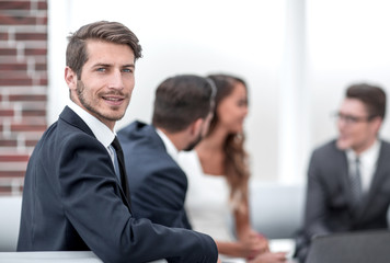 portrait of a successful businessman on the background of the office