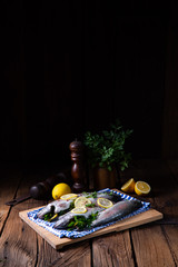 fresh trout with lemon and different herbs