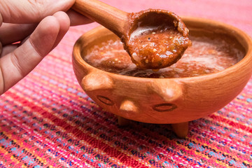 Serving Salsa of Chile de Arbol out of Clay Bowl in Mexico City