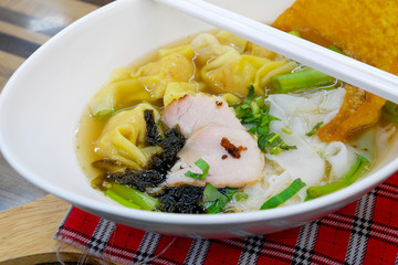 Noodles with dumpling in soup
