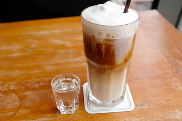 iced coffee on wooden table