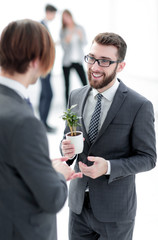 successful young businessman with young sprout