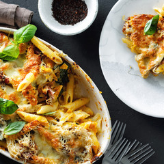 Baked pasta chicken ham mozzarella cheese pumpkin top view comfort food