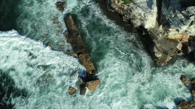 Sea cliffs from above with waves and rocks, Eastern beaches, NSW, Australia, 4K