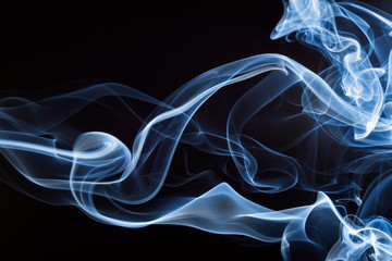 Blue smoke on black background, abstract movement, darkness concept
