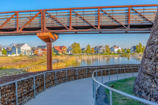 Bridge Over Oquirrh Lake Surrounded By Paved Trail