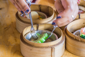 The background of food that is put in a wooden container (dim sum) containing vegetables, pork, flour Used to make, a menu that requires steaming stoves for good taste, delicious to eat 