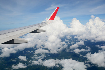 Fototapeta na wymiar Aerial view Clouds and sky as seen through window of an aircraft